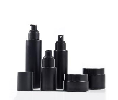 China Personal Care Glass Bottle Set 30ml 60ml 100ml Spray / Empty Matte Black Cream Jar Cosmetics Packaging Set Spray Bottle 30g 50g Pump for sale