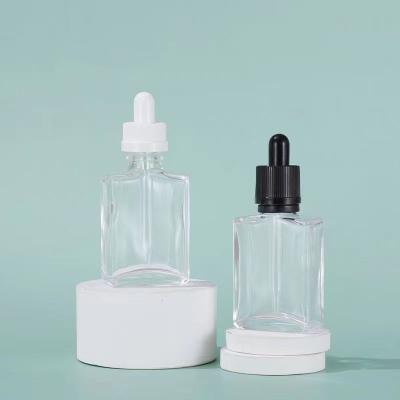 China New Design Perfume Bottle Quadruple 30ml Square Shape Cosmetic Flat Glass Dropper Bottle For Essential Oil Serum for sale