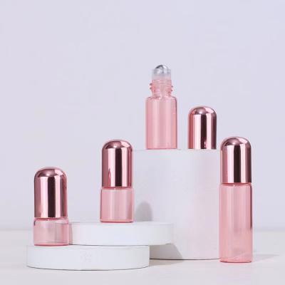 China Personal Care 1ml 2ml 3ml 5ml Pink Translucency Roll On Glass Bottle With Rose Gold Lid for sale