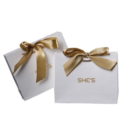 China Custom Logo Printed Hair Wig Packaging Gift Small Jewelry Retail Recyclable White Retail Carrier Gift Shopping Paper Bag With Handle for sale