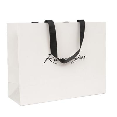 China Competitive Price Recyclable Elegant Custom Brand Logo Luxury Boutique Shopping White Gift Paper Bags With Ribbon Handles for sale