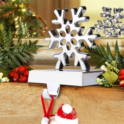 China Hot Selling Classic Premium Christmas Metal Amazon Snowflake Ornament Christmast Stocking Holder For Xmas Fireplace Mantel Decor for sale