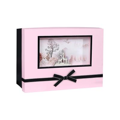 China Recycled Materials Flutter Lid Cardboard Christmas Festival Cosmetic Clothing Pink Paper Box With Window for sale