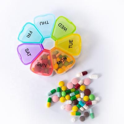 China Petal Shape Pill Organizer /7 Day Weekly Pill Case Petal Shaped Medicine Organizer Daily Pill Container/Portable Travel Pill Box for sale