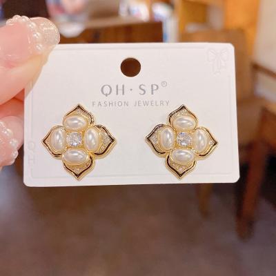 China TRENDY Korean Fashion Personalized Designer Lightly Inlaid Clover Pearl Earrings for sale