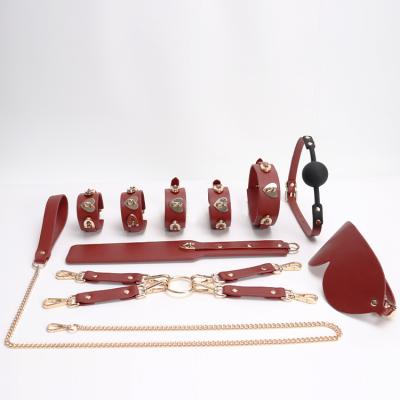 China BDSM Game Best Selling BDSM Bed Fun Leather Limit 10 Piece Fetish Lovers Female Tied Set Adult Flirt Game Set Heart Stud Style for sale