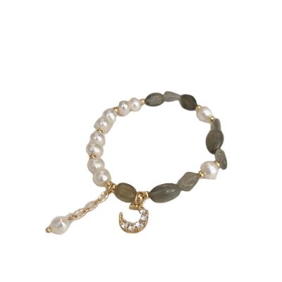 China Fashionable sweet chic natural stone stretch pearl beads freshwater zircon paved moon charm bracelet for sale