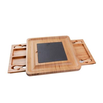 China Sustainable Wholesale Bamboo Cheese Board With Wooden Cutlery Set Charcuterie Tray And Serving Tray Two Ceramic Bowls Slate Labels for sale