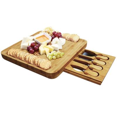 China Sustainable Premium Bamboo Cheese Board And Knife Set Eco - Friendly Wood Charcuterie Cutting Board With 4 Stainless Steel Knives for sale