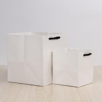 China Recycled Materials Logo Print Shopping Paper Bag Custom Apparel Shoe Packaging Gift Cheap Paper Bag for sale