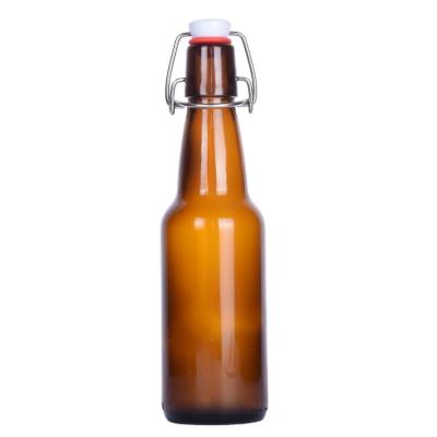 China Hot Selling Amber Color Empty Glass Bottle 330ML 500ML 750ML 1000ML Swing Top Beverage Beer Bottle for sale