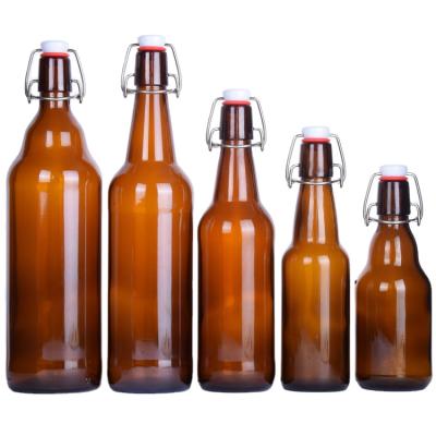 China Hot Selling Empty Brown 330ML 500ML 750ML 1000ML Beverage Maker Glass Swing Top Beer Bottle With Lid For Soda for sale