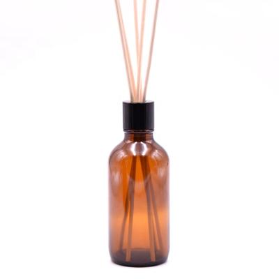 China 100ML Recyclable Eco-friendly Amber Boston Round Bottle Empty Round Shape Reed Diffuser Glass Bottle for sale