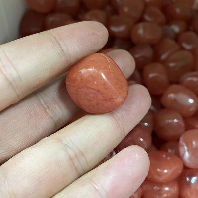 China China Wholesale High Quality Crystal Rolling Stone Volume Polished Aura Red Mao Nao Rolling Stone Decoration And Fish Tank for sale