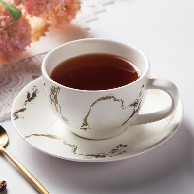 China Viable Wholesale Personalized Porcelain 200Ml Coffee Cups And Tea Cup Sets Gold Marble Design With Saucer for sale