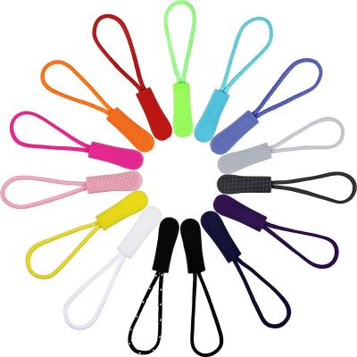 China Eco - Friendly Soft Injection Molding PVC Zipper Puller With String for sale