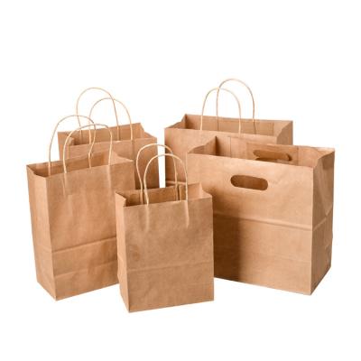 China Custom Printing Die Cut Handle Eco Friendly Biodegradable Recycle Kraft Paper Bag With Hole Handle for sale