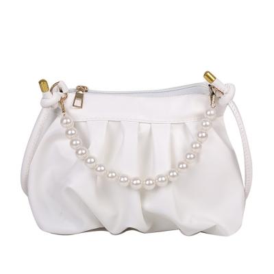 China 2022 anti-theft new pearl handbag advanced western style pleated bag one shoulder cloud oblique bag for sale