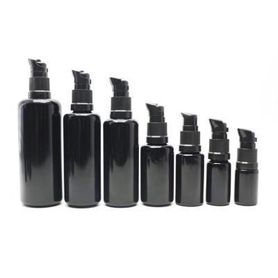 China Personal Care New Trends Cosmetic Wholesale Package Glass Bottle Dropper Round Shape 15ml 30ml 50ml 100ml Glass Black Bottle for sale