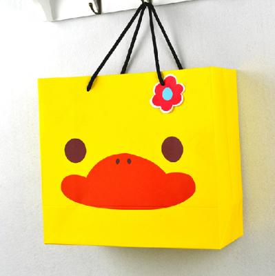 China Recycled materials wholesale cheap price cute cartoon shopping handbag paper bag with your own logo for sale