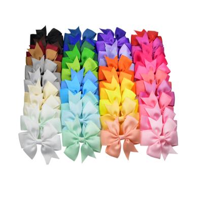 China Smart Ribbon Pet Accessories Solid Color Pet Accessories Fashion Headdress Dog Love Bow Fishtail Stocked Fishtail Hairpin for sale