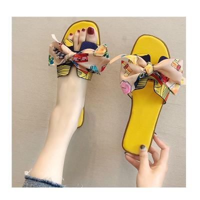 China PVC 2021 Summer Fashion Women's Floral Bow Slippers Indoor Outdoor Flip Flops Beach Shoes D0548 for sale