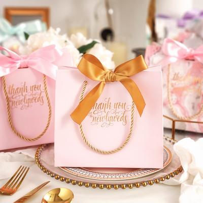 China Custom Fancy Printed Gift Bag Security Wedding Favor Bag Candy Chocolate Paper Bag With Ribbon for sale