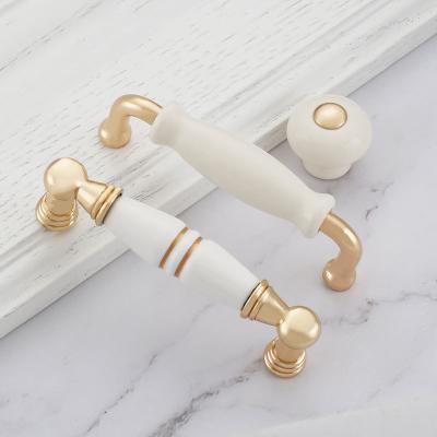 China Modern simple gold wardrobe door handle wardrobe cabinet drawer light ceramic luxury European lengthen cabinet gold handle for sale