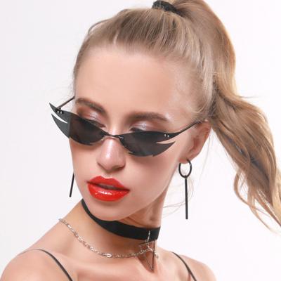 China Newcomers European and American shooting street sunglasses punk fashion Cat Eye Sunglasses Female Trend Frameless fashion sunglasses for sale