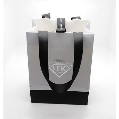 China Recyclable Shopping Paper Bag Kraft Paper Bag Personality White Paper Full Color Printing Bag for sale