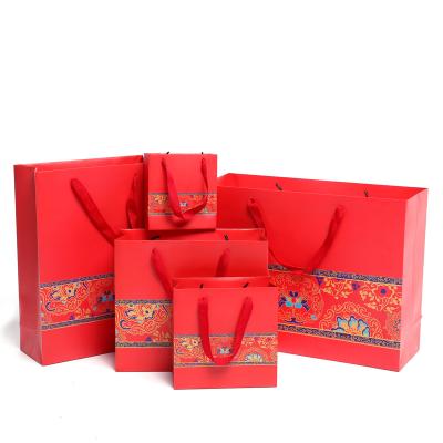 China Recyclable Wedding Paper Bag Printing Paper Design Customized Bag Your Products Fashion Red Paper Gift Bag for sale