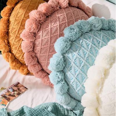 China Anti-Static Soft Handmade Round Knitted Cushion Cover With Pompom Decorative Pillow for sale