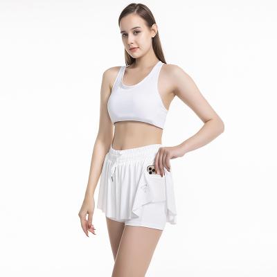 China Custom Active Anti-Wrinkle Wear Workout Gym Shorts 2 In 1 Sporty Women Table Tennis Skirt Shorts With Pockets for sale