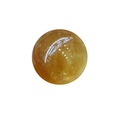 China Feng Shui Wholesale Natural Crystal Spar Yellow Sphere Ball Iceland Calcite Optical Quartz for sale