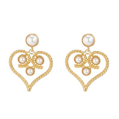 China Other Best Selling 18K Gold Plated Hollow Rough Pearl Earrings Elegant Heart Stud Earrings Ring for sale