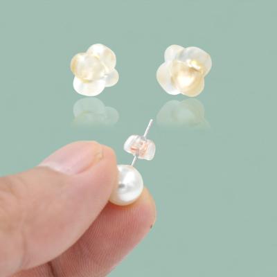 China Silicone Jewelry Making Accessory Earring Back Plug Four Leaf Clover Shape Clear Plastic Earring Back Plug for sale