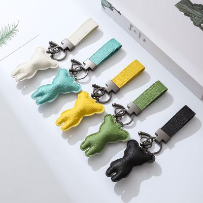 China Simple Style Creative Design Jewelry Doll Fashion Key Chain Bracelet For Men And Women Hand Rope Metal Car Gifts Customized Key Chain for sale