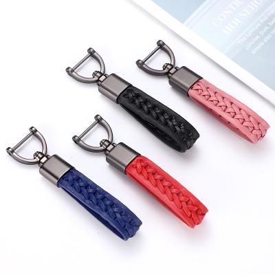 China Leather Simple Creative Design Jewelry Fashion Key Chain Bracelet For Men And Women Hand Rope Metal Car Gifts Customized Key Chain for sale