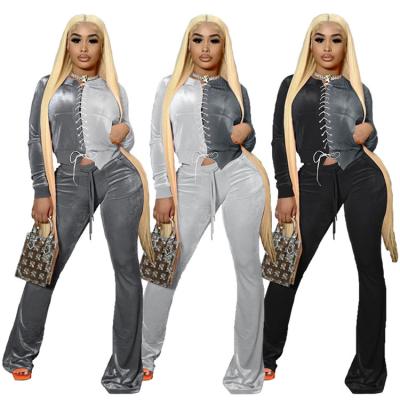 China Breathable Velvet Sweatsuit Fashion Color Patchwork Two Piece Set Lace Up Pockets Top Boot Cut Out Women Two Piece Outfits for sale