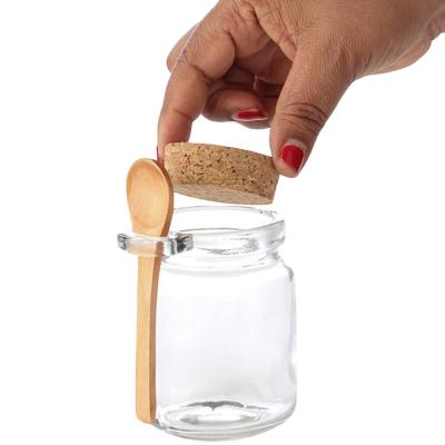 China Wholesale Viable 200ml 200g Round Empty Clear Food Storage Container Honey Glass Jar With Wooden Spoon for sale