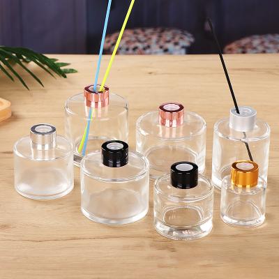 China Home Office Recyclable Fragrance Glass Empty Round Reed Aroma Diffuser Bottle With Screw Top for sale