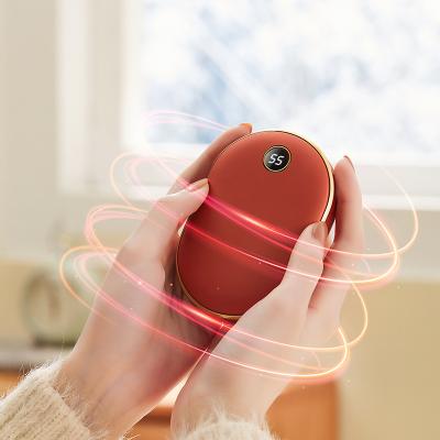 China Hotel Hand Body Warmer 10000mAh Mini Fast Heating Hand Warmer Portable Rechargeable Hand Warmer Power Bank OEM for sale