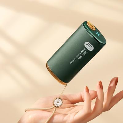 China 10000mAh Rechargeable Reusable Hotel USB Power Bank Mini Electric Warm Hands Phone Hand Held Warmer for sale