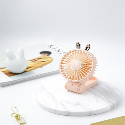 China Small Portable Foldable Handheld Pink Fan Portable Mini Desk Cooling Hand Fan Rechargeable Table Top Rabbit Fan for sale