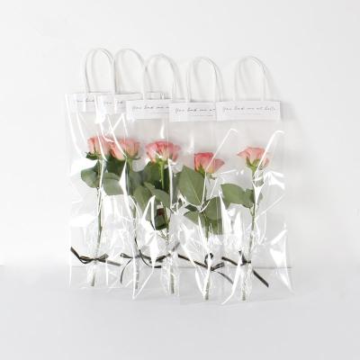 China Recycled Materials PVC Recyclable Clear Plastic Bag For Flower Gift Waterproof Pink Flower Package Bag Opp Plastic Carry Bags With Handle for sale