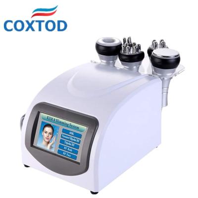 China Face Lift COXTOD 40K RF Vacuum Beauty Multifunction Fat Repellant Instrument For Home Use On Face And Body for sale