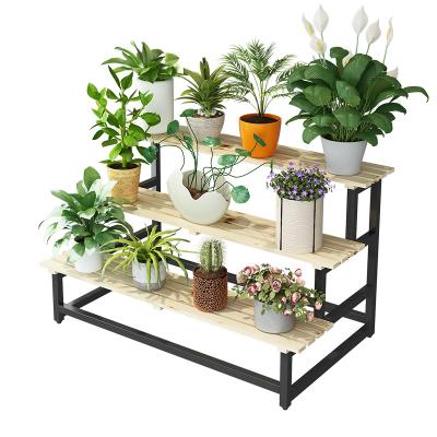 China Yantai adjustable living room multi-tiered flower rack (other) modern simple iron stepped storage rack for sale