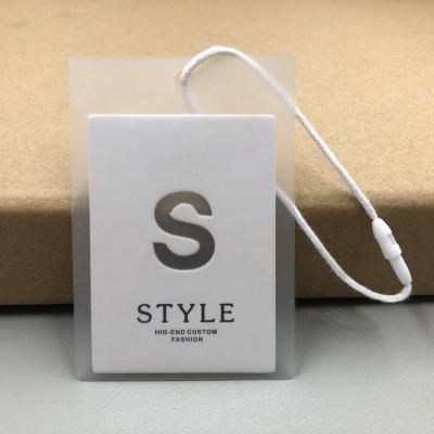 China Show fashion custom printing white thick cardboard stock garment clothes tag with string PVC bag, hang tags for sale