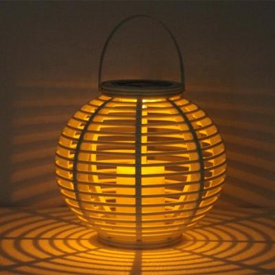 China Kanlong wholesale garden solar rechargeable round rattan led light lantern plastic candle inside outdoor use garden light for sale