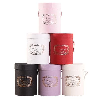 China ZL Recyclable Wholesale Hot Stamp Luxury Packaging Clothes Flower Doll Gift Craft Round Cardboard Tube Box With Rope Handle And Lid for sale